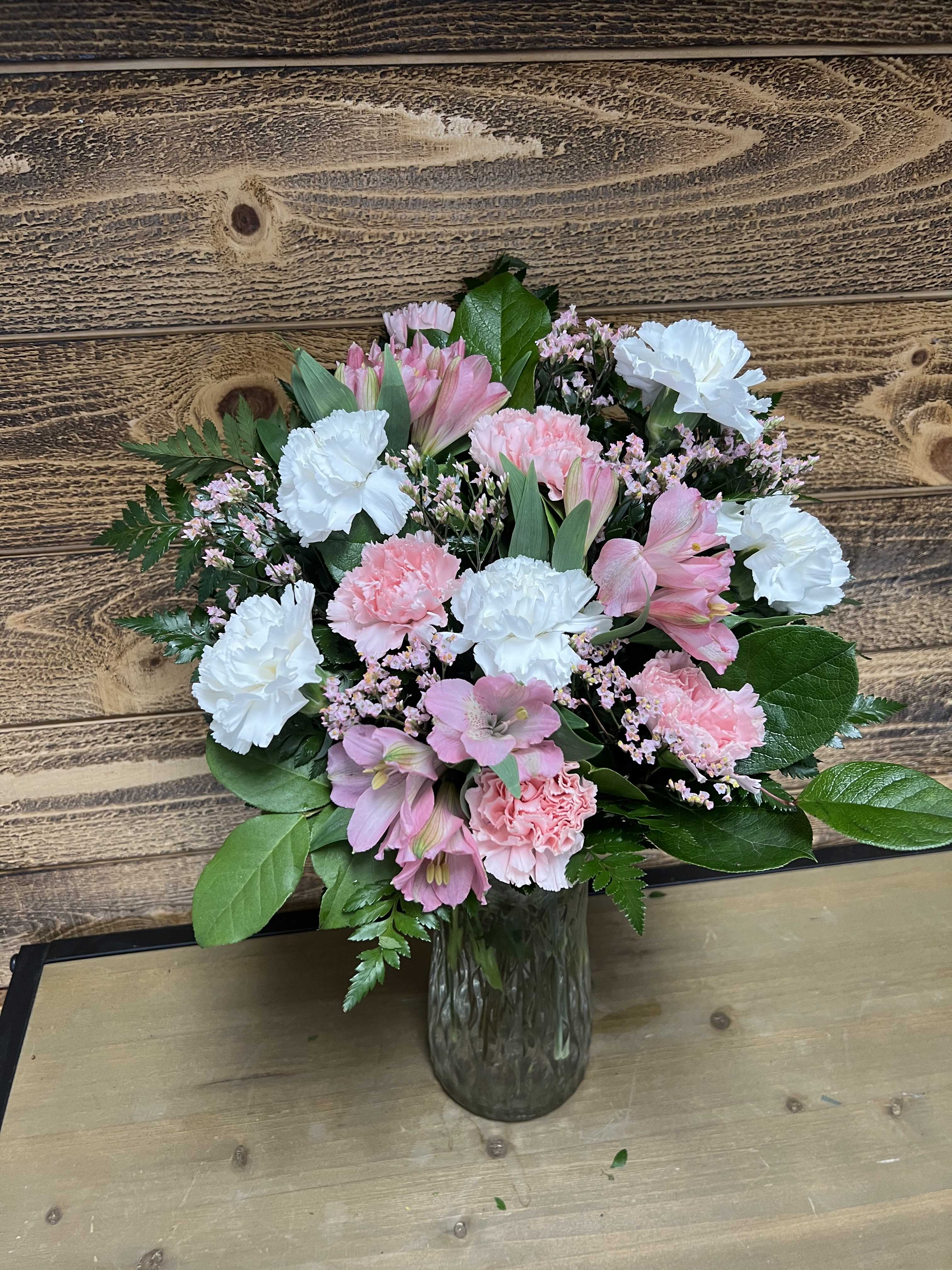 Pink and white bouquet in a glass vase