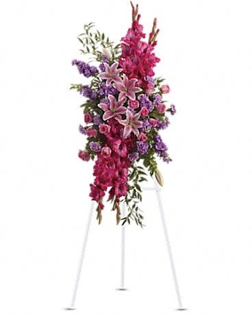 Touching Tribute Spray - Express admiration for her beauty and spirit with a striking tribute certain to evoke many cherished remembrances. Gorgeous flowers such as pink roses, oriental lilies and gladioli blend with purple stock, lavender carnations and fragrant greens.