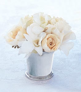 White and cream bouquet in a small silver vase