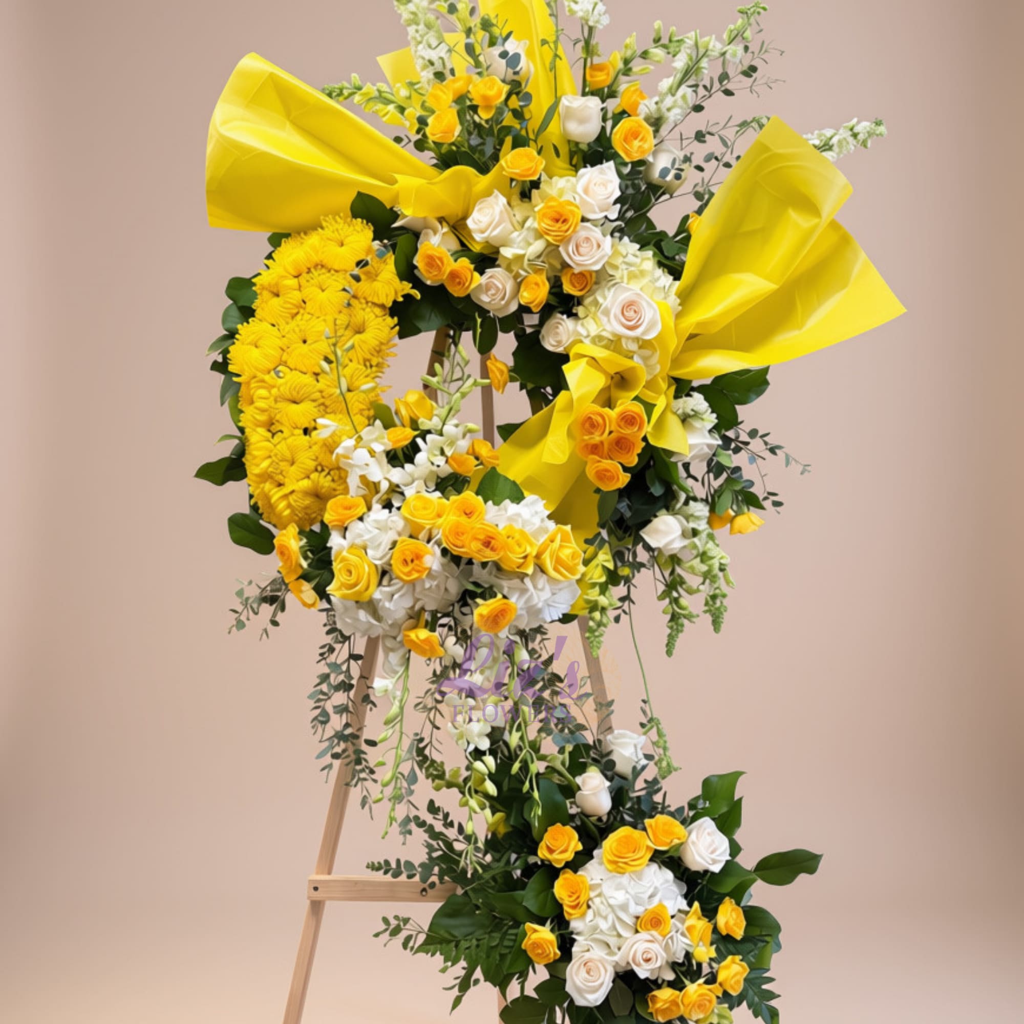 Yellow and white floral wreath on a wooden easel with large yellow bows