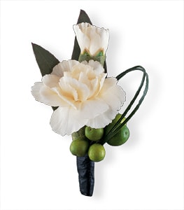 White carnation boutonniere with green berries and dark leaves