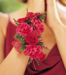 Pink floral wrist corsage with roses and carnations