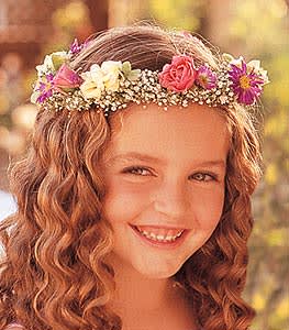 Girl wearing a floral crown with pink and purple flowers