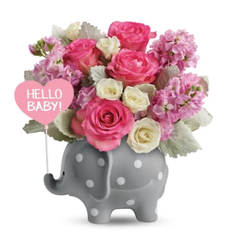 Pink and white roses in a gray elephant vase with a "Hello Baby!" sign