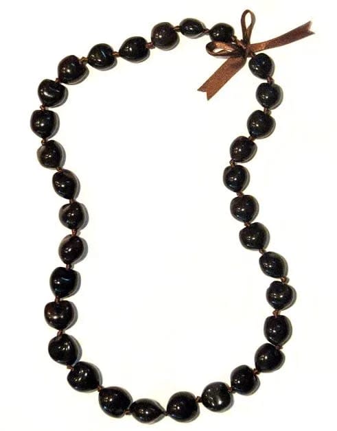 Dark bead necklace with a small brown ribbon bow at the top