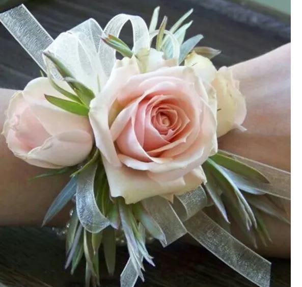Classic Wrist Corsage  - **White is sold out** Classic wrist corsage that includes ribbon, focal flowers and accent flower. Please leave your color choice in the special instructions for a customized corsage. If no color choice is given, designer will do a neutral color palette.**Please Note** Due to the custom requests for corsages ALL SALES are FINAL at the time of Purchase. **flowers may vary from photo shown**