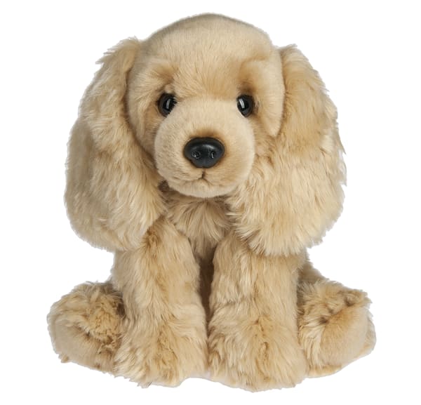 Plush tan puppy with floppy ears sitting on a white background