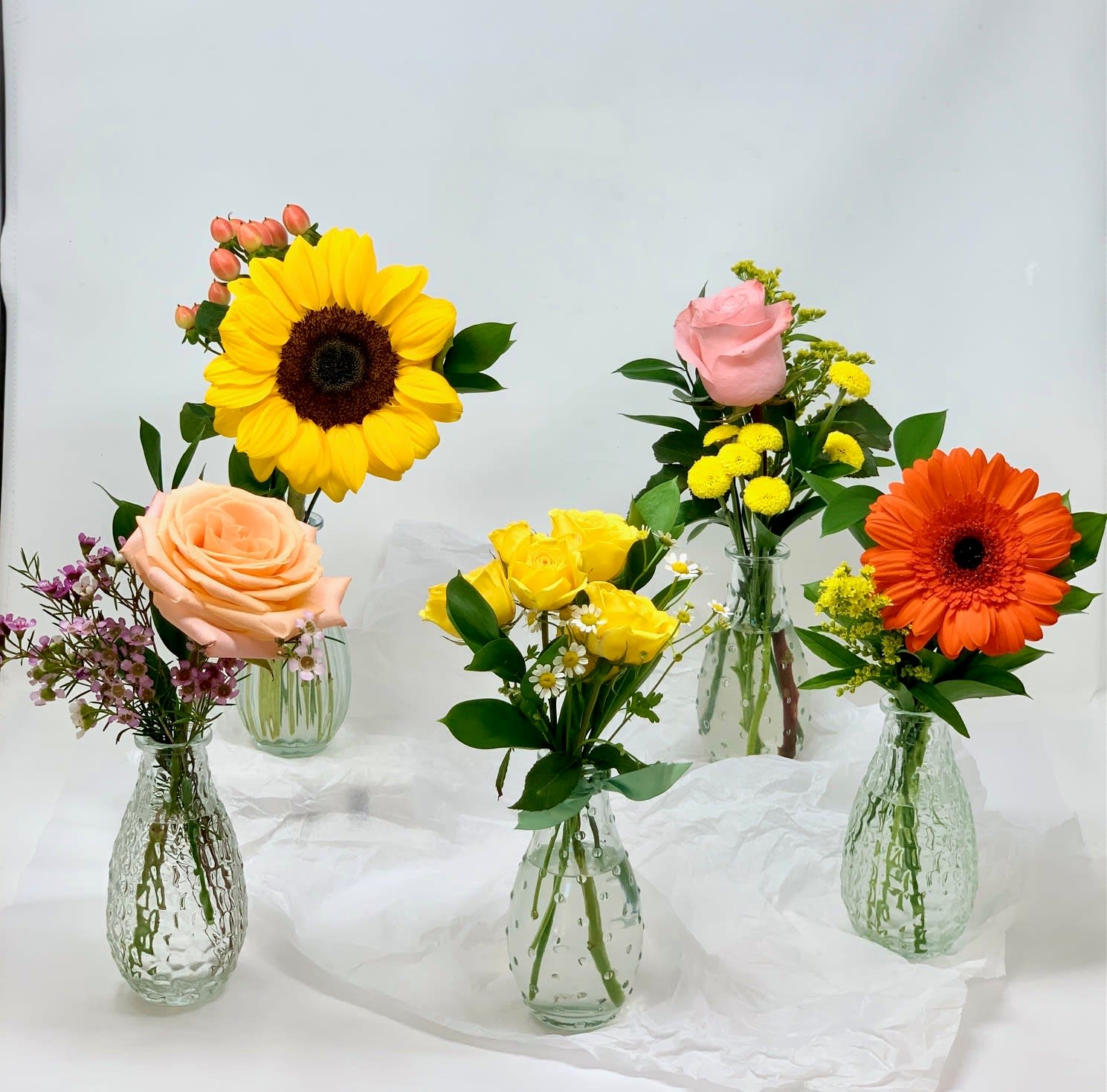 Bud vase - Each bud vase is arranged with one single seasonal flower, the thriller, a filler and greenery.