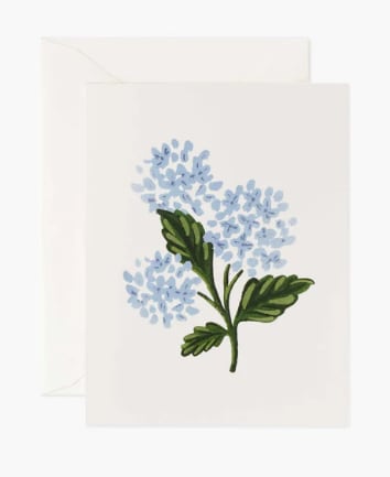 White card with a blue floral sprig illustration