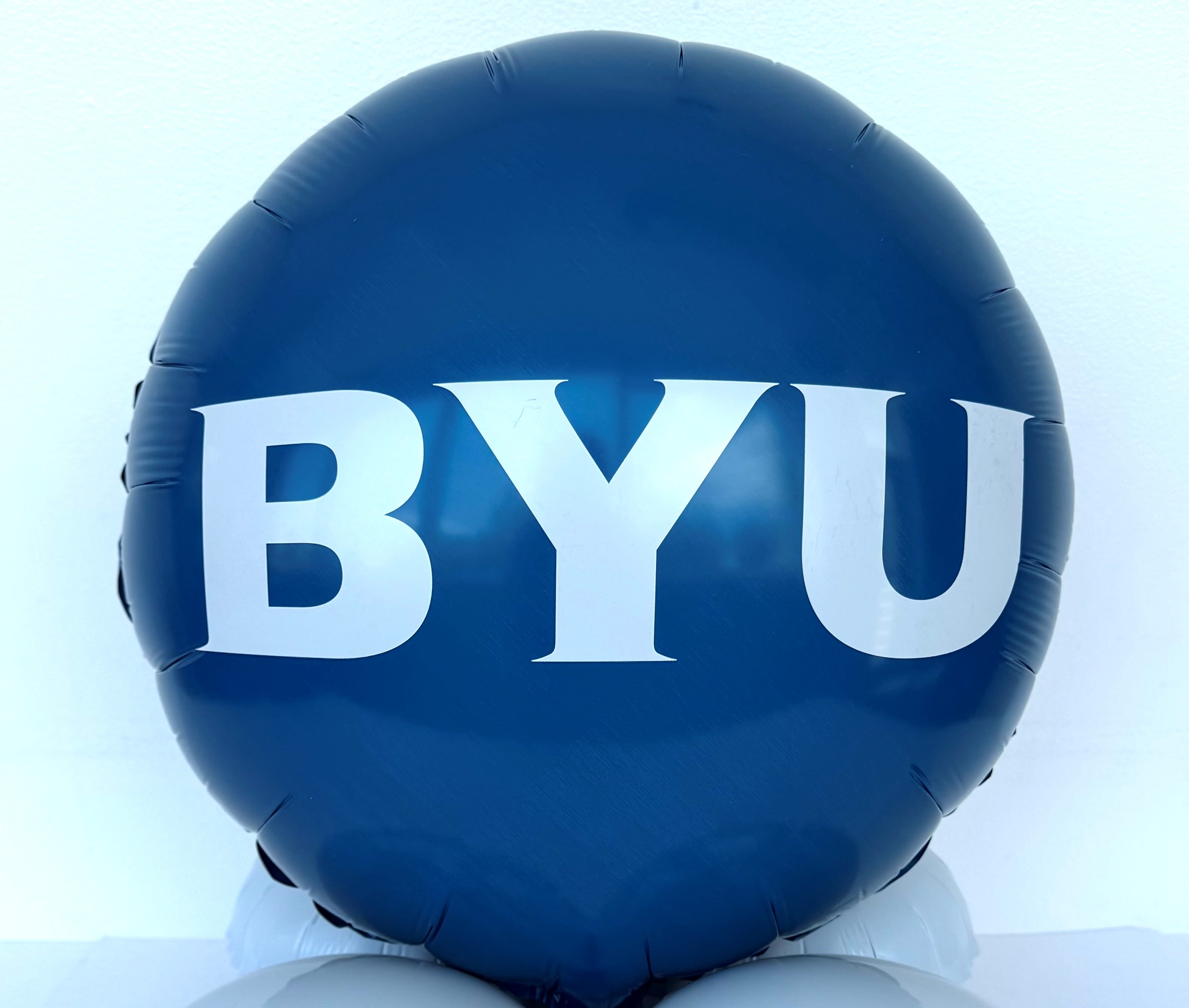 Blue balloon with large white BYU letters
