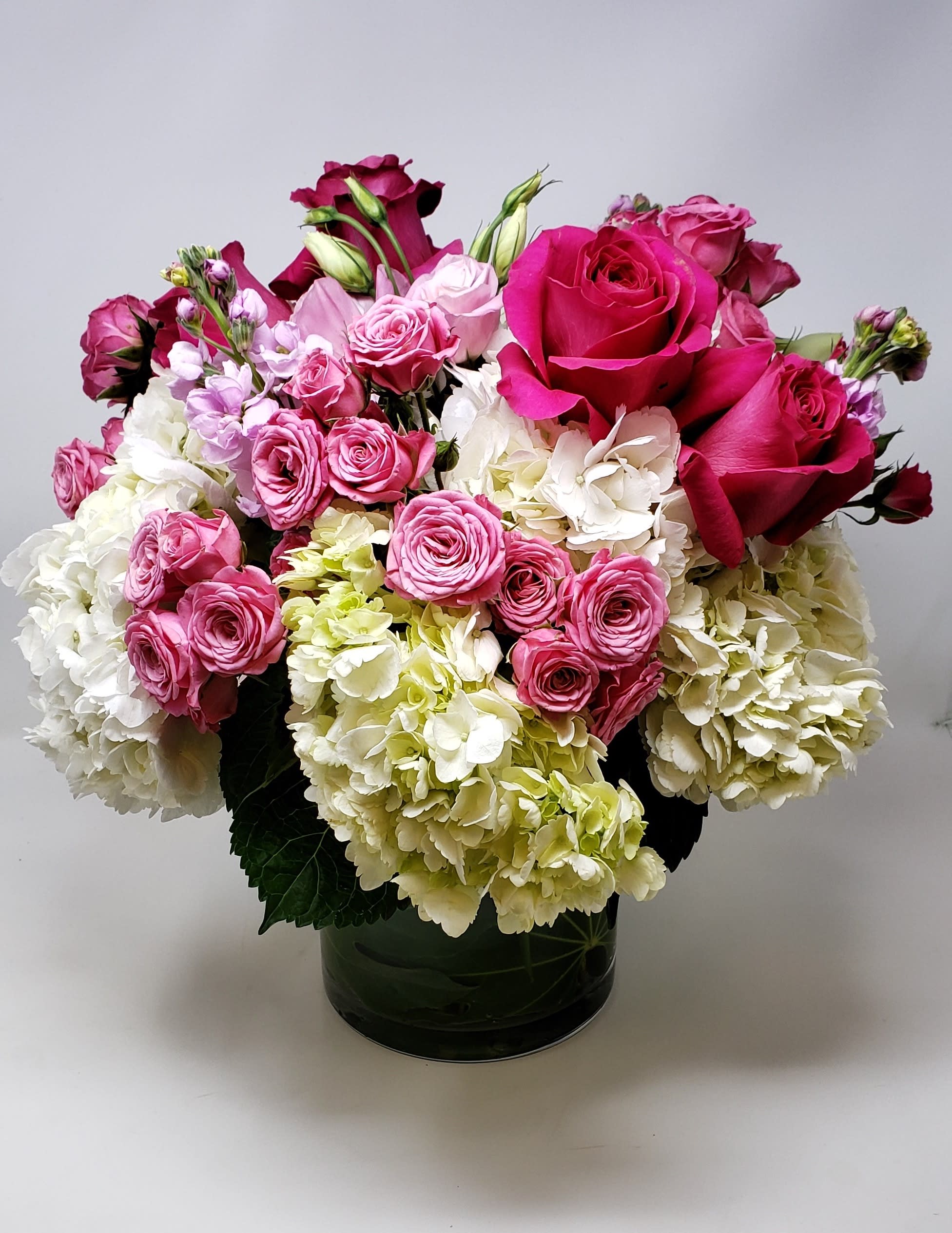 Style me Pretty - A full lush and pretty feminine bouquet with hydrangeas, roses, fragrant stock, lisianthus, all soft and delicate blooms