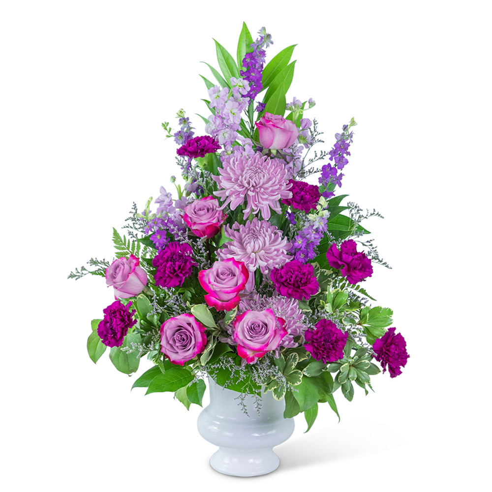 Pink and purple flower arrangement in a white vase