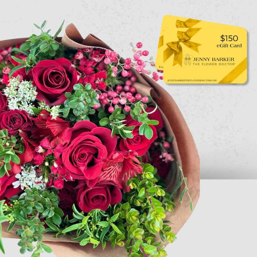 Bouquet of red roses with pink berries and a gift card