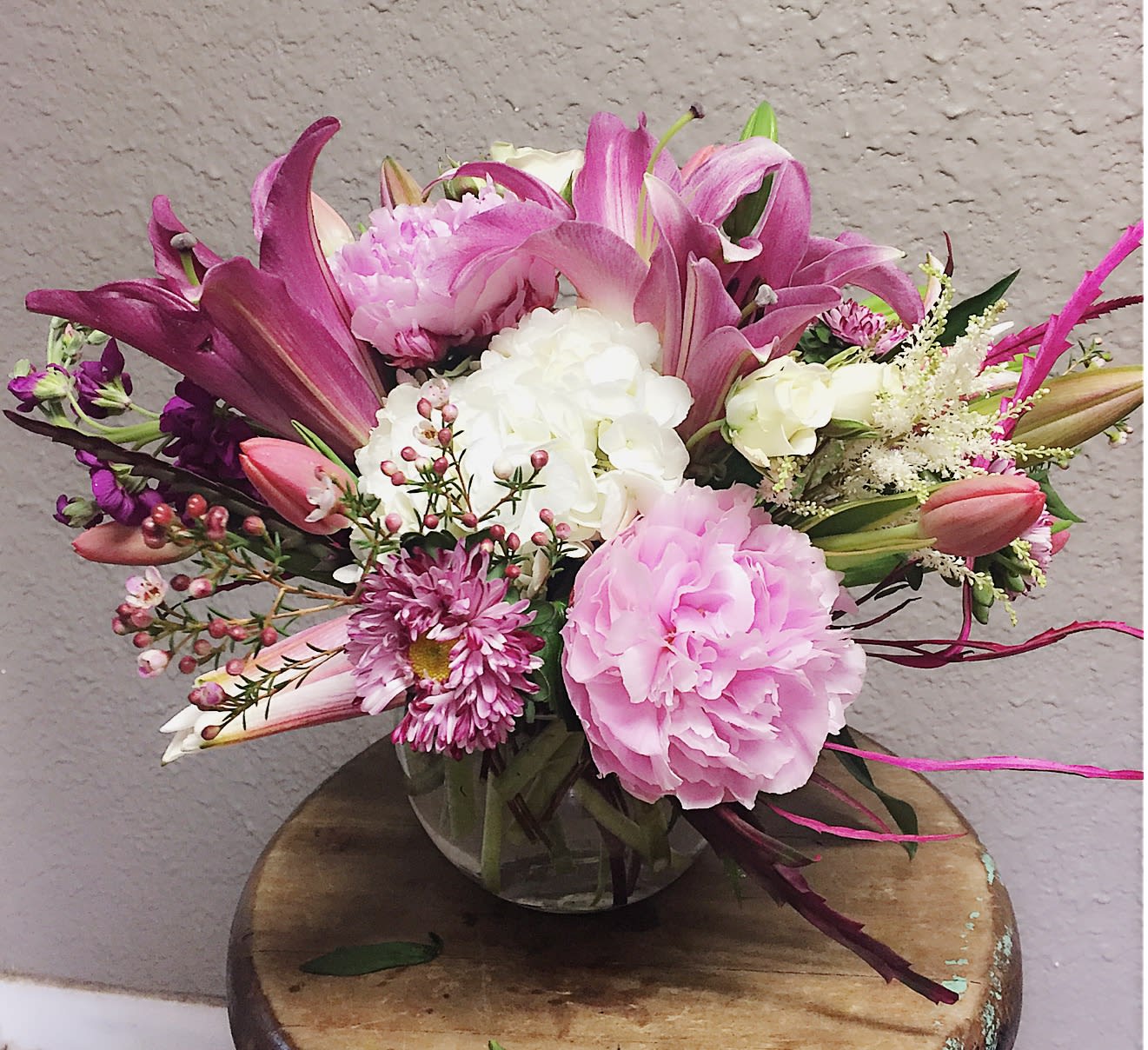 Pink and white mixed bouquet in a clear glass vase