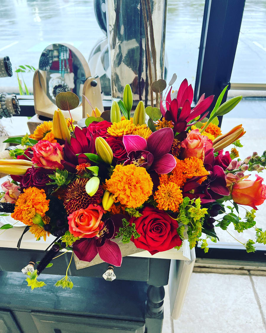 Bright mixed bouquet with roses, lilies, and orange mums