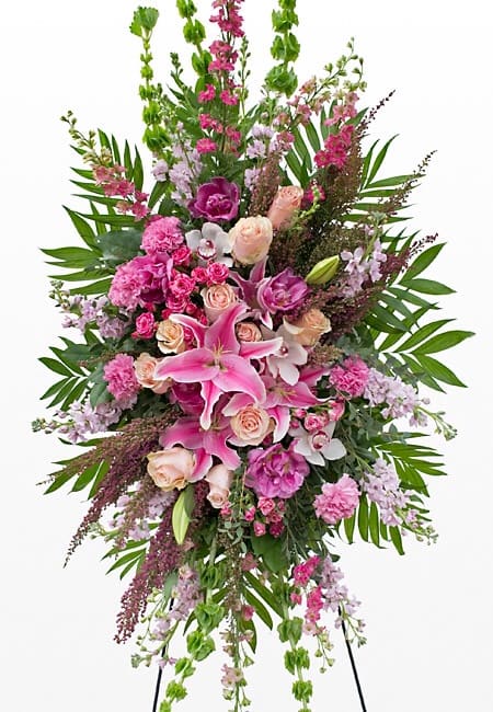Tall pink and lavender floral spray with lilies and roses