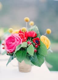 Small bouquet of colorful flowers in a wrapped container