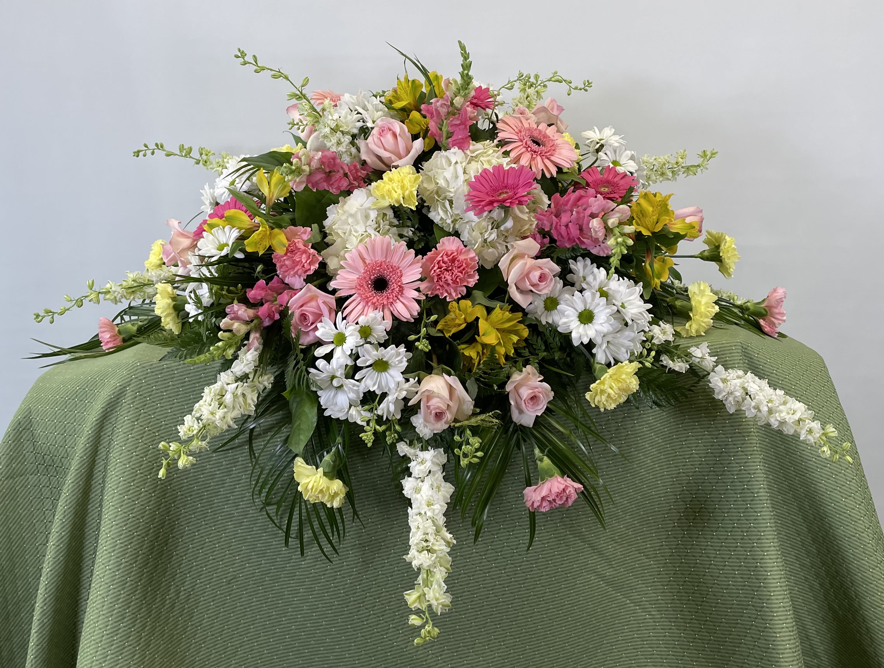 Large mixed floral spray with pink, white, and yellow blooms