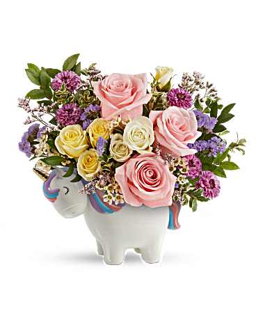 Bouquet of pink and yellow roses in a white unicorn vase