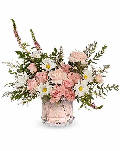 Pink roses and white daisies in a clear glass vase