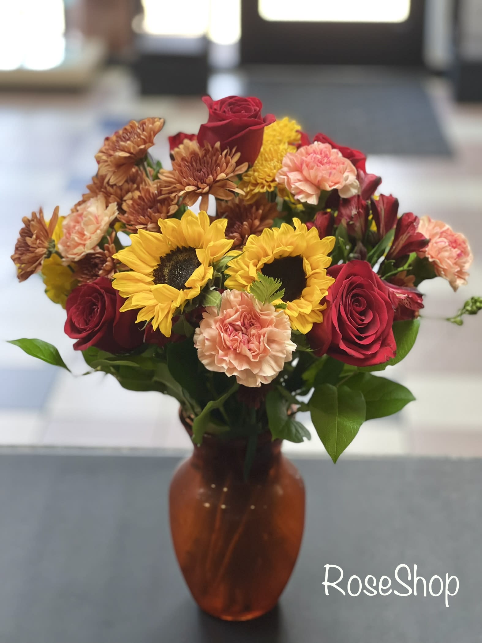 Radiant Fall - Celebrate fall in sweet and radiant style. We’ve brought together a richly colored bouquet with our best quality flowers for a gift that brings seasonal feelings to every gathering.
