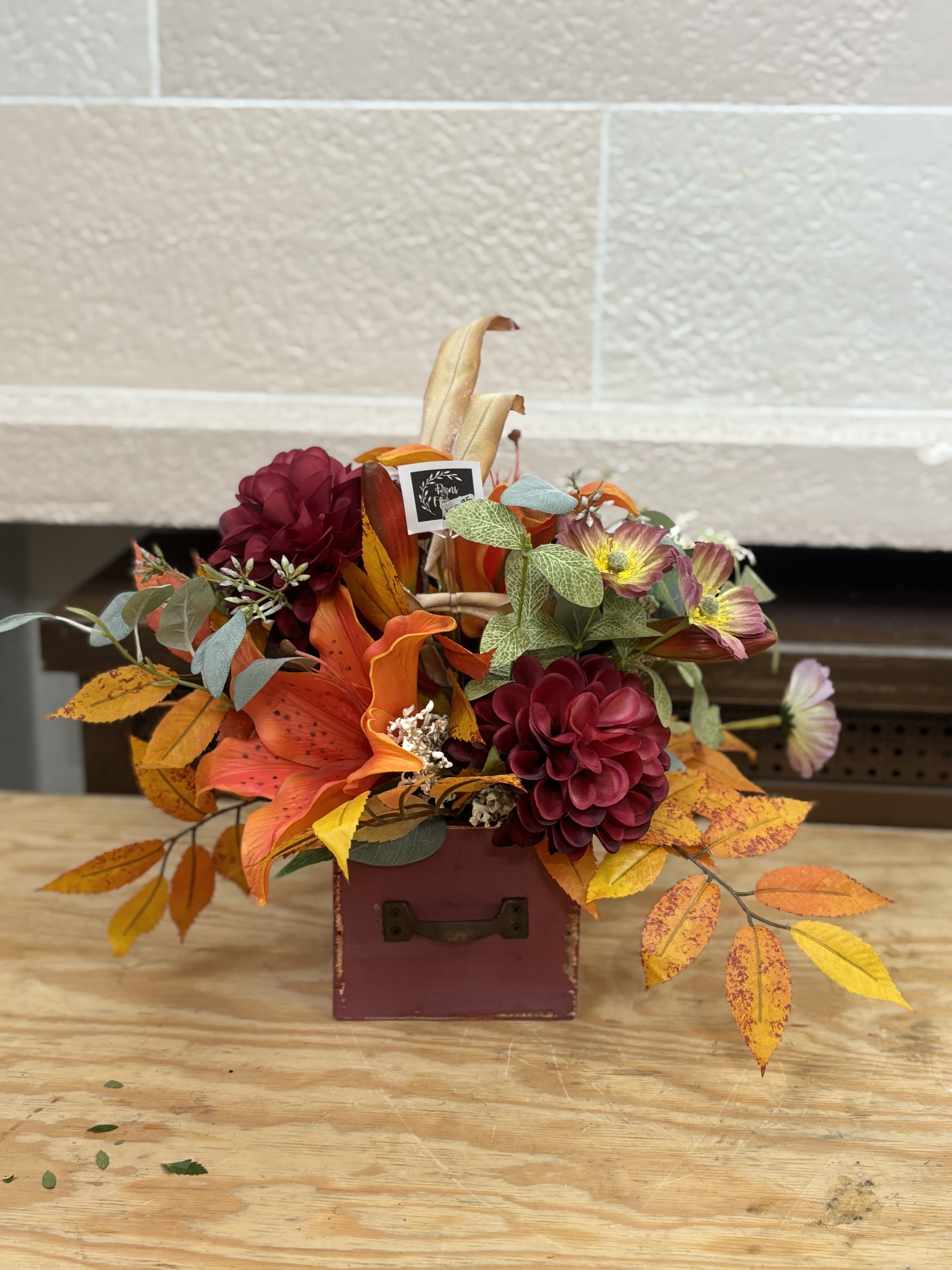 Artificial Fall Drawer  - A fall artificial arrangement in a drawer pot. 