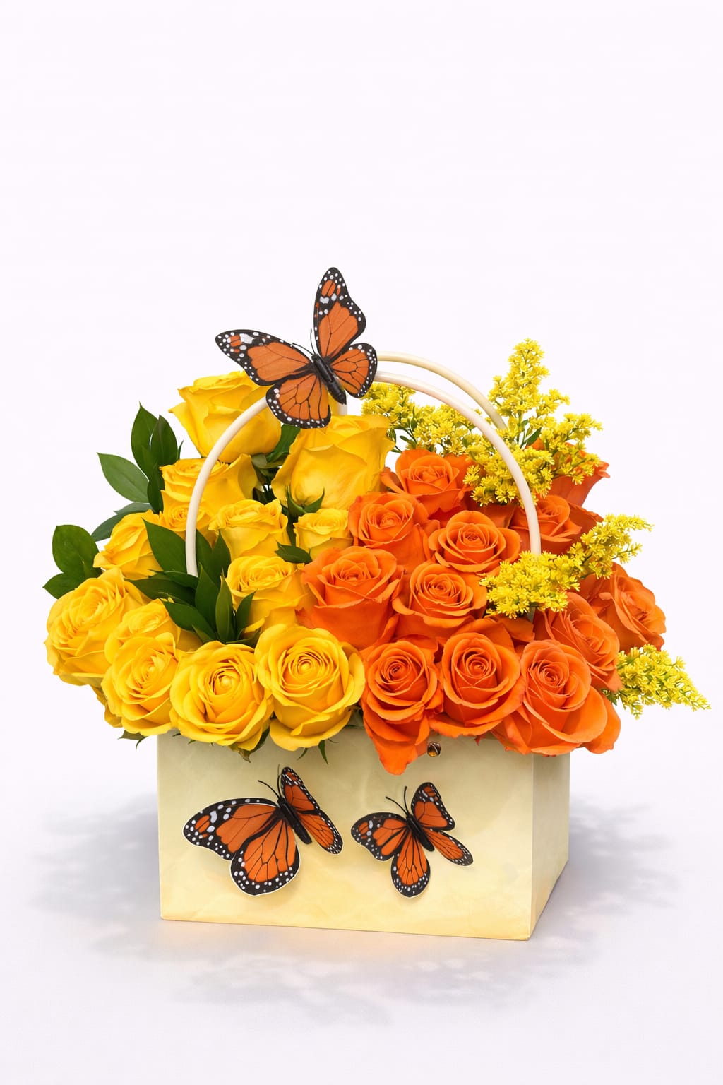 Yellow and orange roses in a box with butterfly decorations