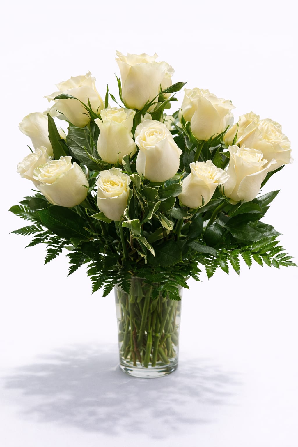 Bouquet of white roses in a clear glass vase