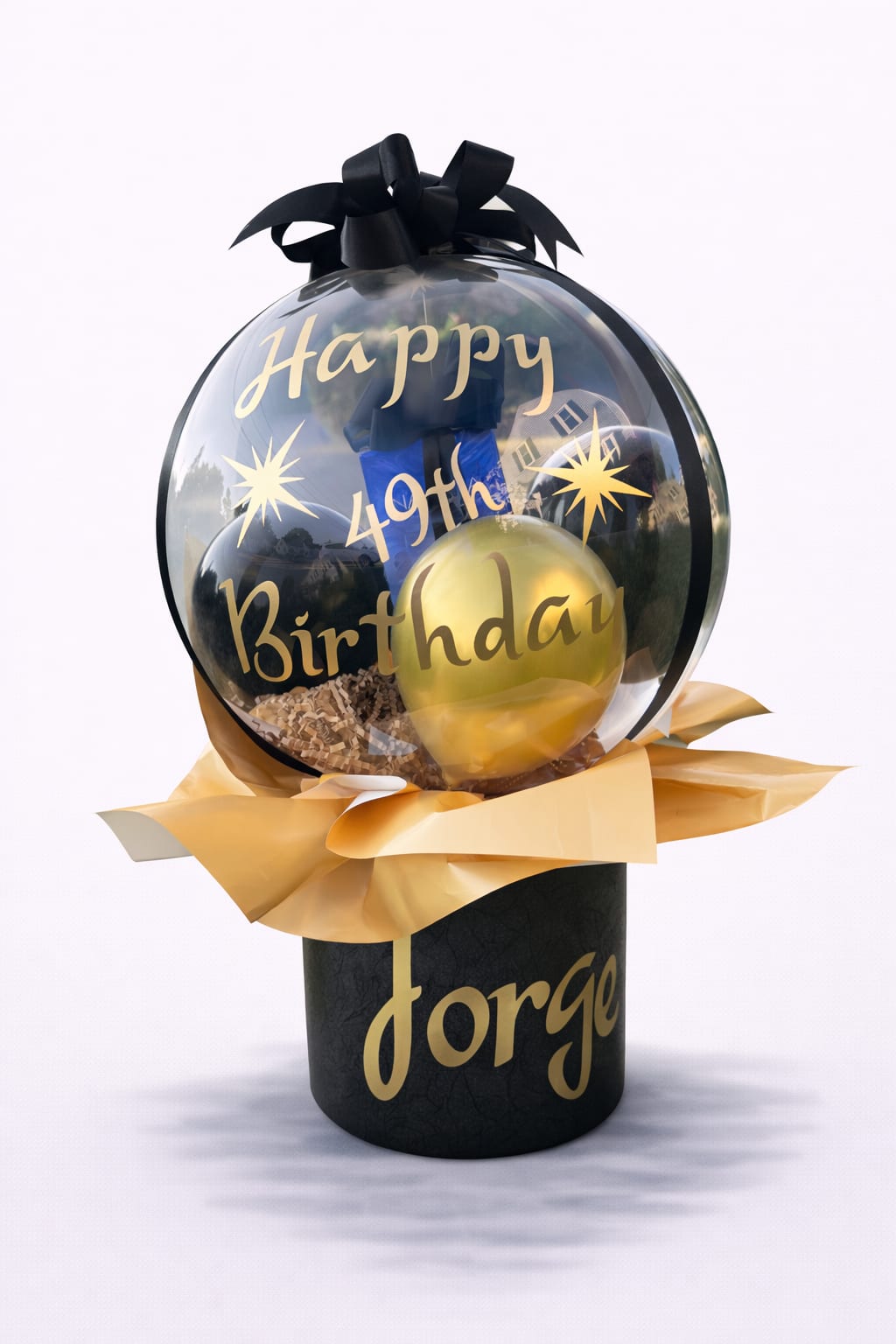 Birthday balloon gift with black and gold balloons in a clear dome