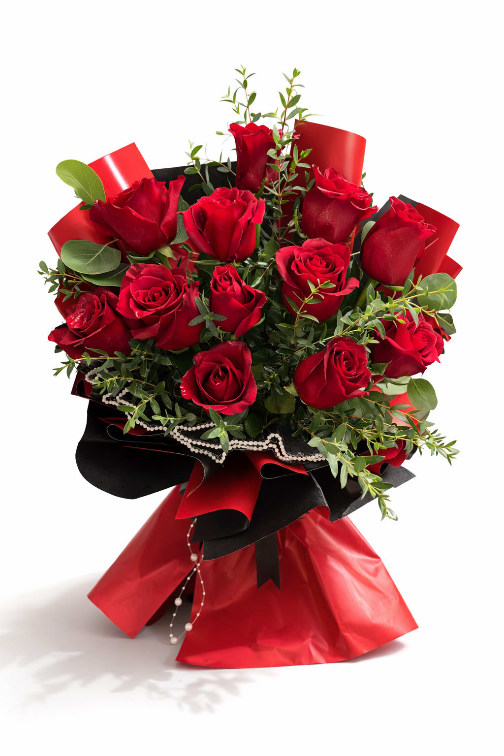 Bouquet of red roses with greenery wrapped in black and red paper