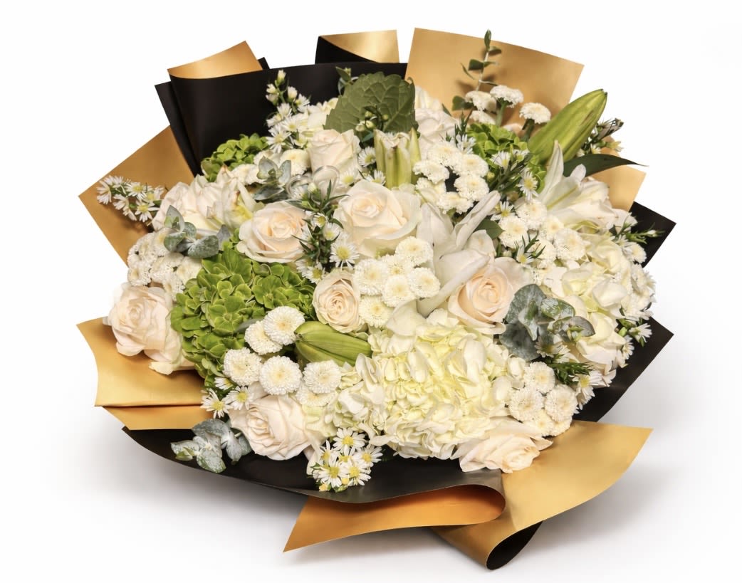 Garden of Serenity - A full and harmonious bouquet in ivory white and fresh green tones, featuring cream roses, white and green hydrangeas, chrysanthemums, mini daisies, lilies, and carefully selected greenery that adds texture and depth. Wrapped in elegant black and gold paper, creating a modern and refined contrast. A light-filled design, perfect for expressing peace, sincere love, and heartfelt wishes.