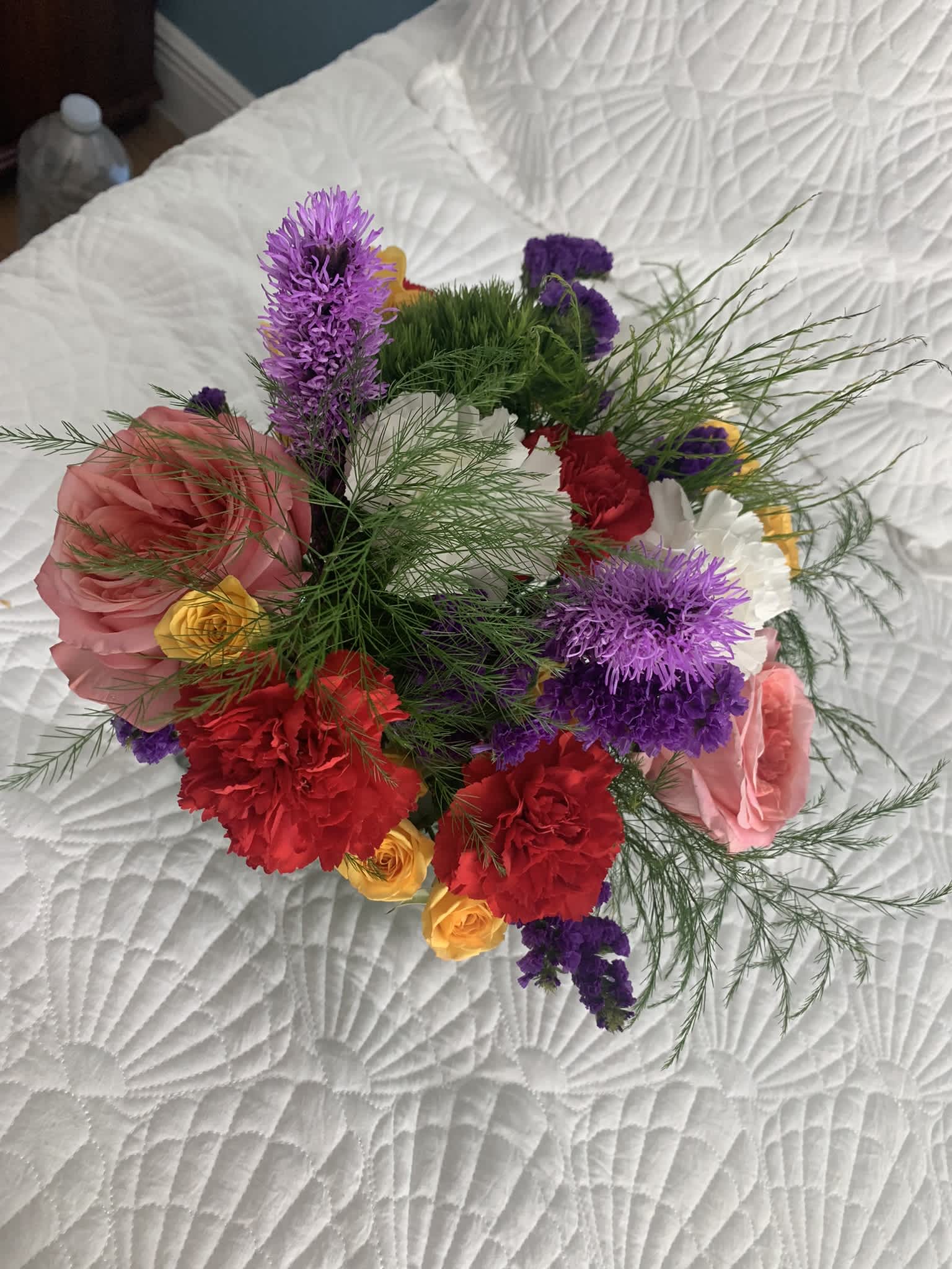 Mixed bouquet with pink, red, purple, and yellow flowers