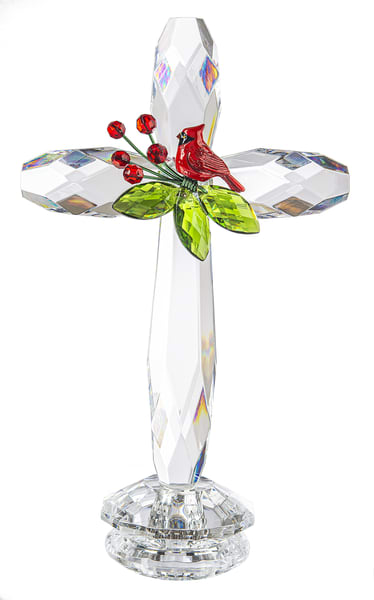 Cardinal Standing Cross - This beautiful clear cross features a red cardinal perched among green leaves and berries, symbolizing love, hope, and remembrance. It makes a meaningful keepsake on its own or, upon request, may be added into a smaller funeral arrangement. Please note that the floral arrangement would need to be purchased separately and approved, as not all designs can accommodate this piece. Approximately 7.5 inches tall.