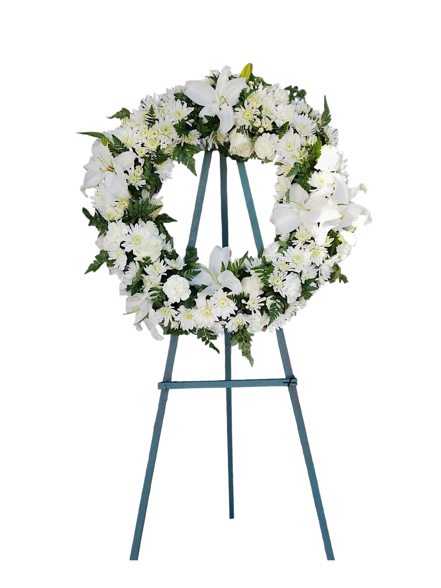 Lasting Serenity - A beautiful white and green tribute wreath that calms, this easel arrangement celebrates a full life and a peaceful passing. This type of design is usually approximately 5 - 6 ft tall and is meant for funeral services ONLY. This design includes a free banner (please include a banner sign in the Special Instruction Box or Message Box with the title “BANNER”).  In the event a banner space is left blank for any reason, ONLY a card message will be included. Banners are printed in a black 2.5-inch wide ribbon with silver ink. Currently, we don't offer any other colors. If the service is the same day as the order was placed we cannot guarantee delivery by a certain time. And flowers will be delivered during normal business hours.  A smaller heart of red roses inside a larger heart orange rose create a gorgeous spray for a funeral. To ensure the delivered flowers match the displayed photo as close as possible we recommend ordering 3-5 days in advance. For the same or next day deliveries, we reserve a right to substitute flowers with the same or greater value.