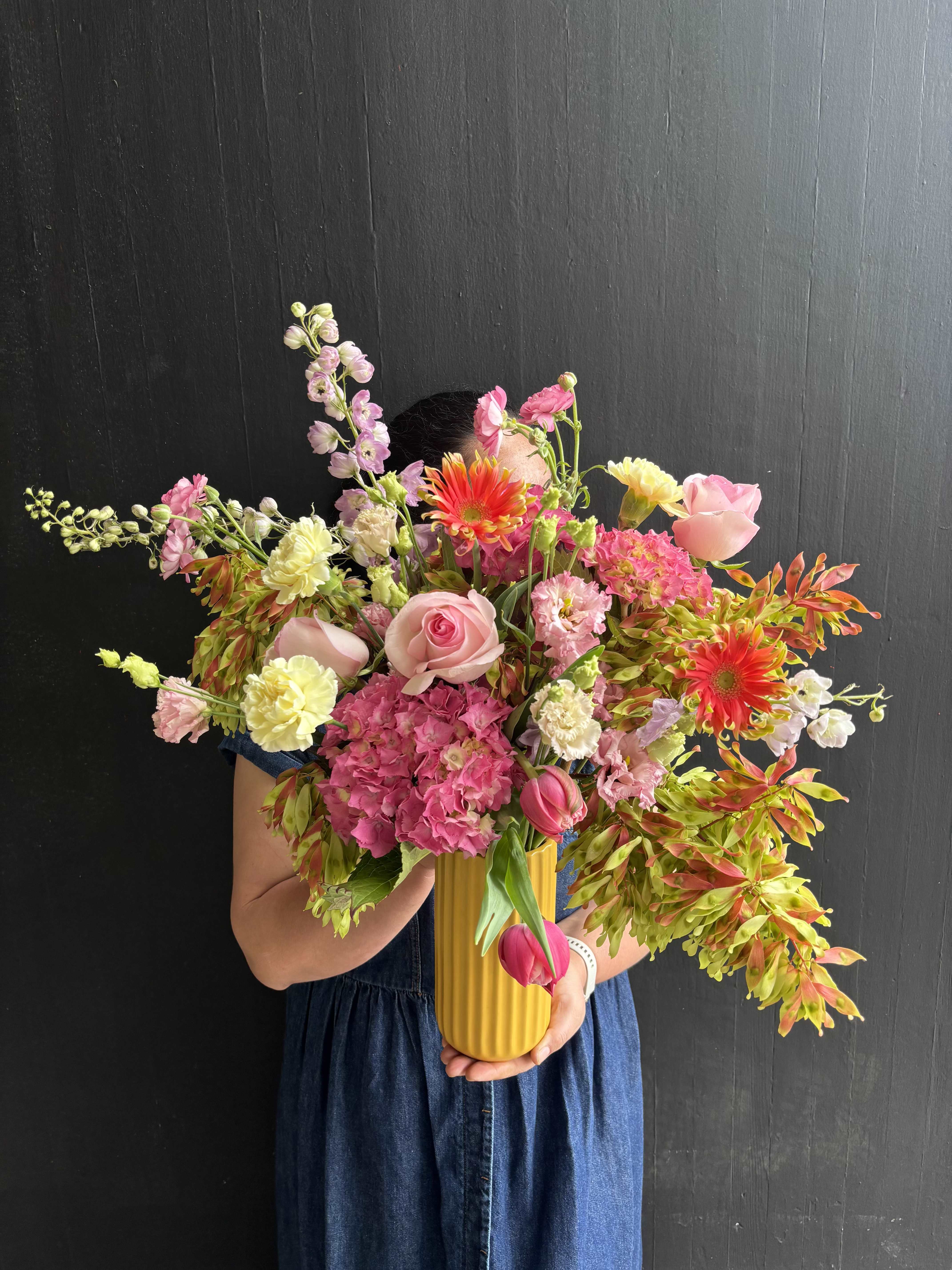 Wild Abundance - A Bright and refreshing design of garden hydrangeas, roses, and tulips.   Our "Designs of the Week" collection offers a seasonal selection of fresh flowers. These arrangements will be updated weekly,  with fresh and fun designs that will change with the season. Our goal is to  always offer a new look and feel in every design. Enjoy the early availability of the freshest seasonal flowers and foliage while they are in season! 
