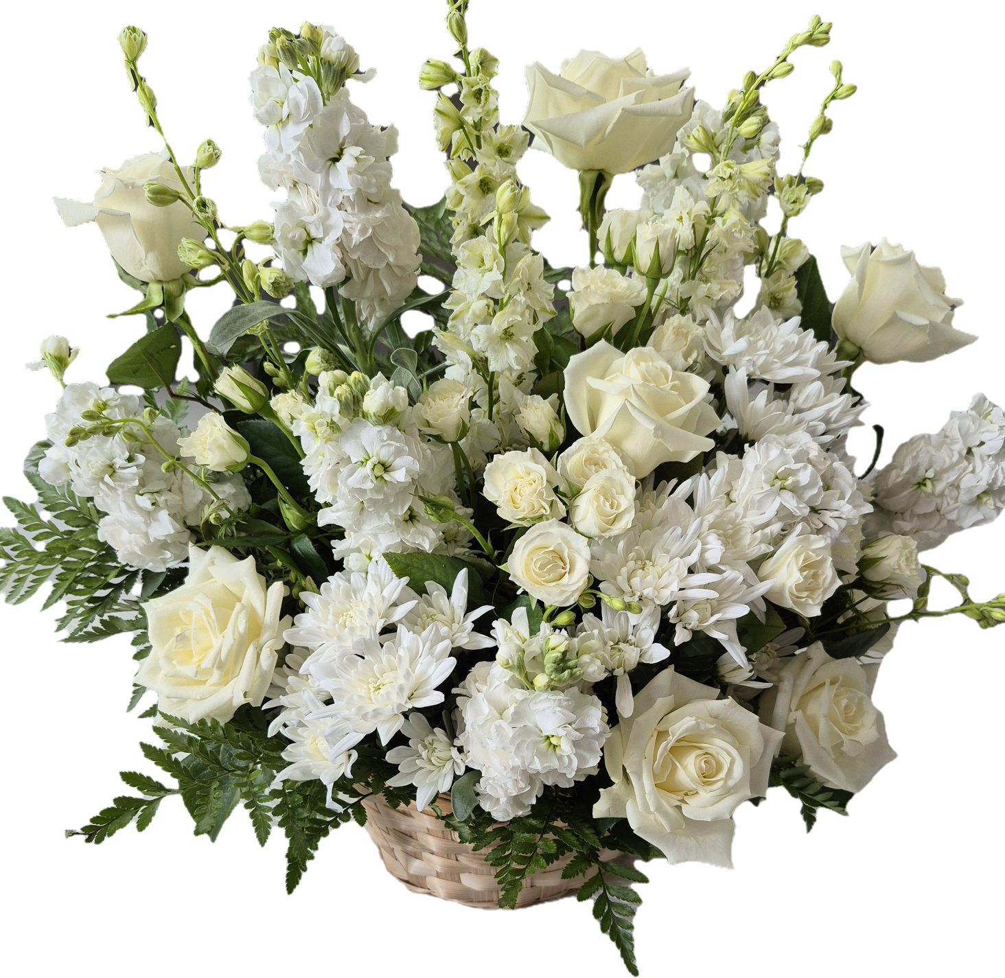 White roses and chrysanthemums arranged in a basket