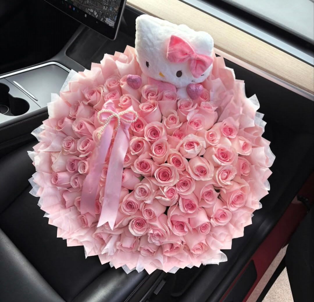 Large pink rose bouquet with a Hello Kitty plush topper