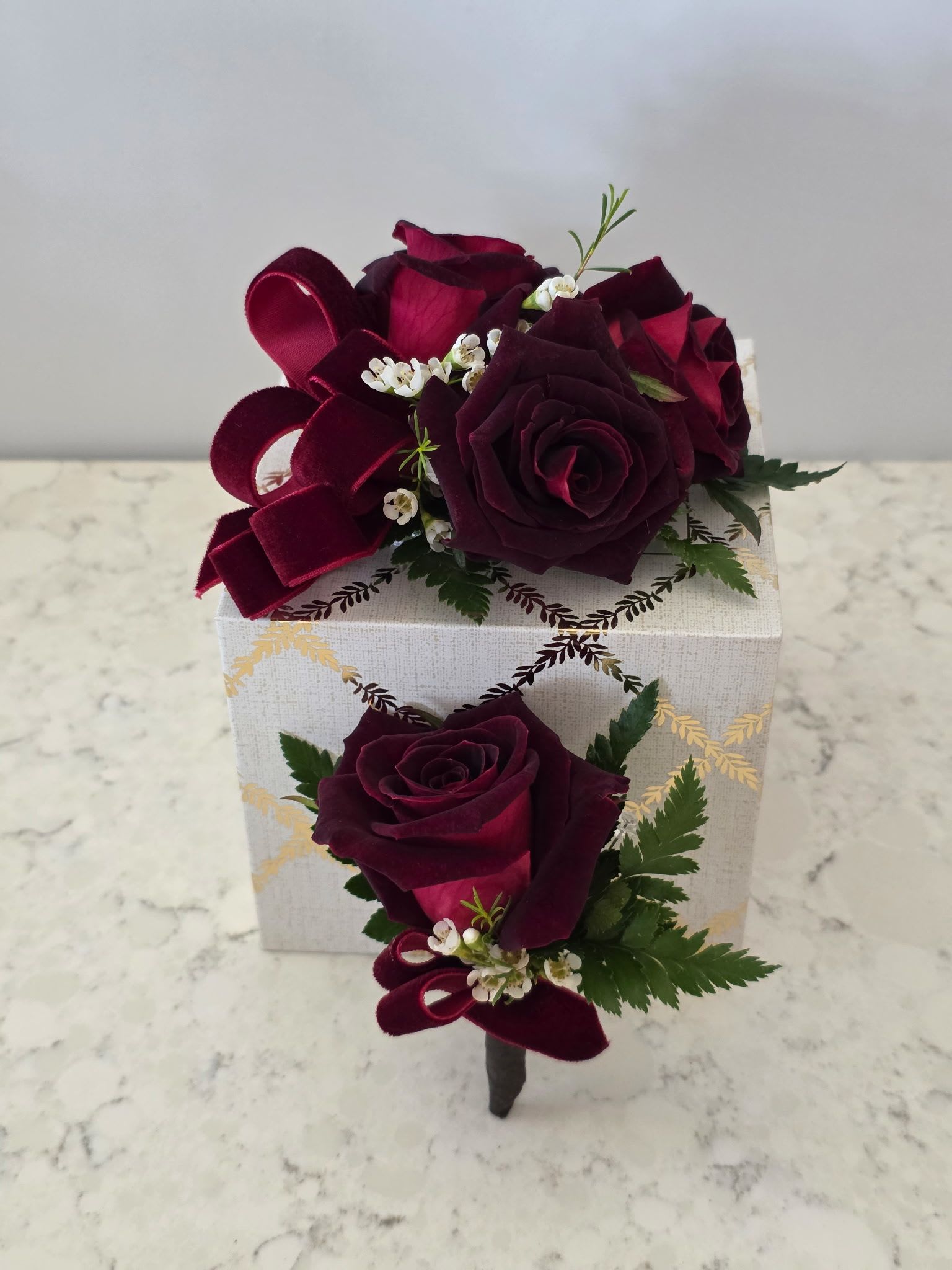 Wine Burgandy Corsage &amp; Boutonniere - Prom, Wedding, or Formals - Deep burgundy (wine) roses with white and green accents, velvet ribbon loops and greenery; gift-boxed corsage and boutonniere set for elegant weddings, prom, or anniversaries.