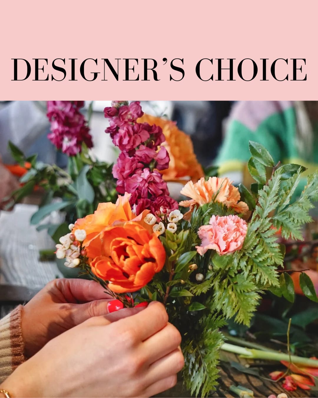 Handheld bouquet with orange and pink flowers and greenery