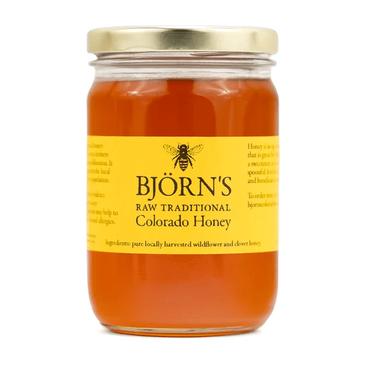 Jar of Colorado honey with a yellow label and gold lid