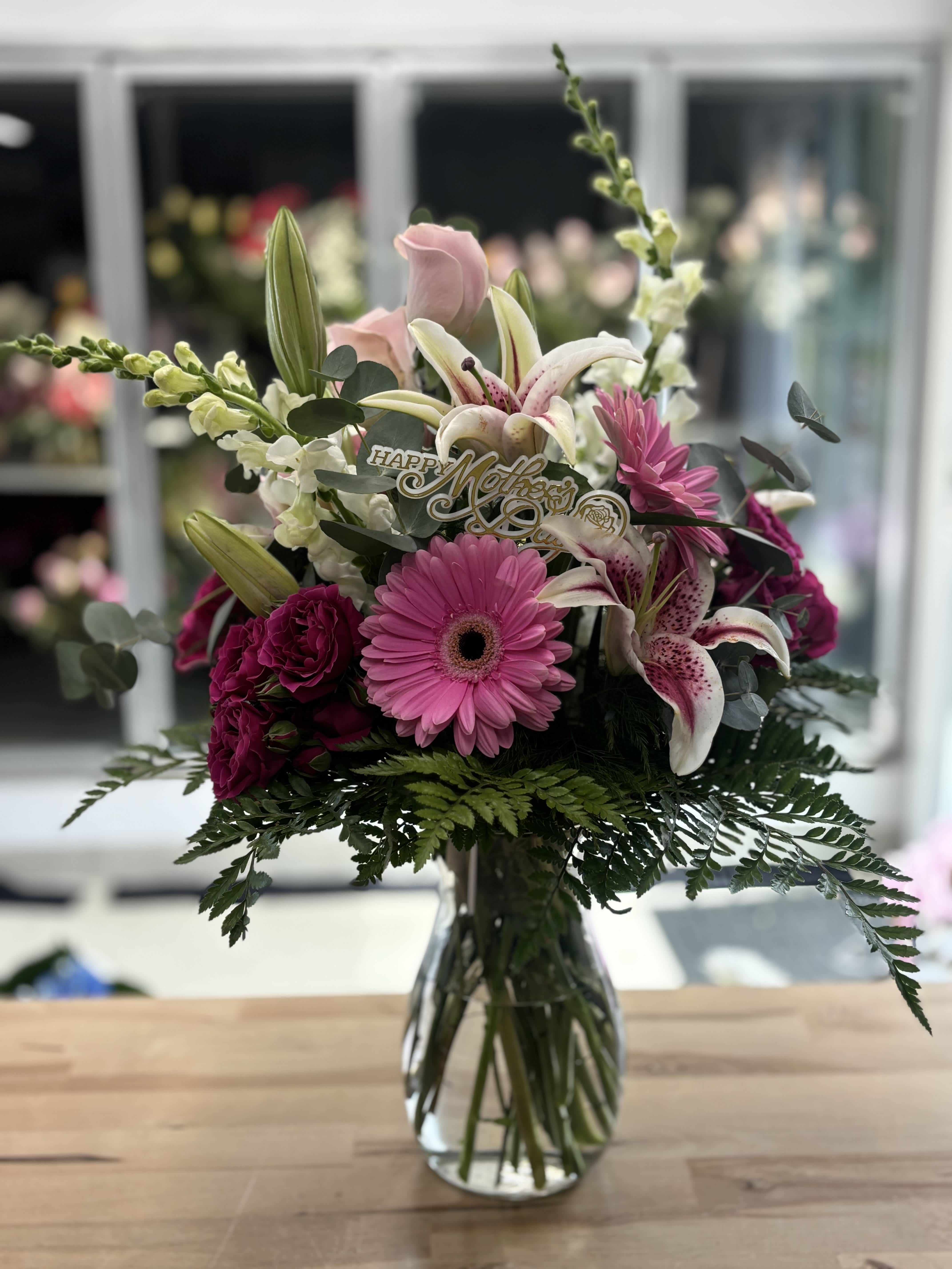 Pink and white mixed bouquet in a clear glass vase