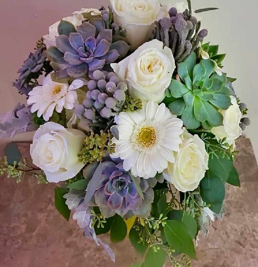 Bouquet of white roses, white daisies, and purple succulents