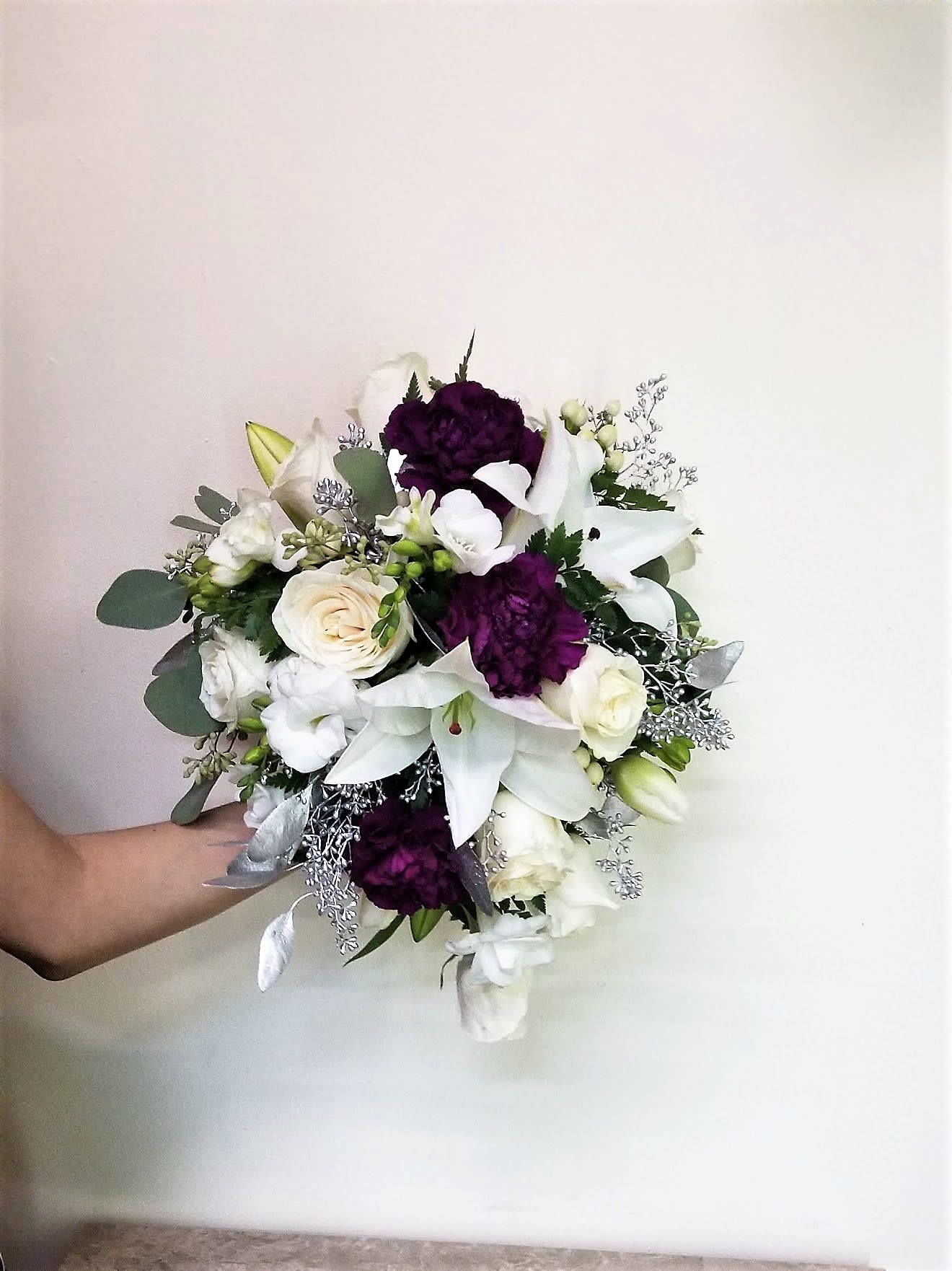 White and purple bouquet with lilies and roses