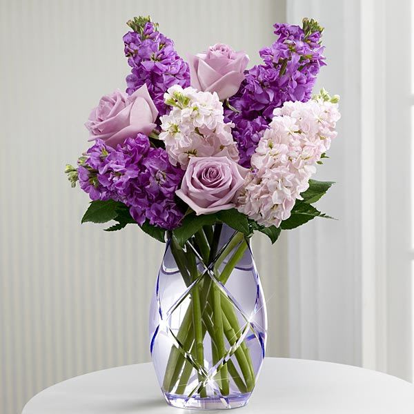 Sweet Devotion™ Bouquet by Better Homes and Gardens® - The FTD® Sweet Devotion™ Bouquet by Better Homes and Gardens® brings together roses and stock stems to design a wonderful wish for perfect happiness for your special recipient. Lavender roses and stock are accented with pink stock and lush greens to create an amazing flower bouquet. Lovingly arranged in a designer lavender etched glass vase, this flower arrangement offers them a beautiful expression of your sweetest sentiments to celebrate Mother's Day, extend your happy birthday wishes or to help celebrate the arrival of spring. EXQUISITE bouquet is approximately 20"H x 16"W.