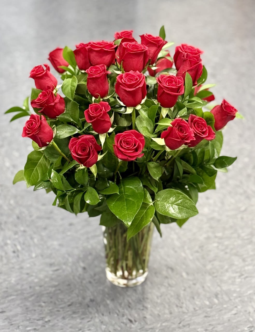 Bouquet of red roses in a clear glass vase