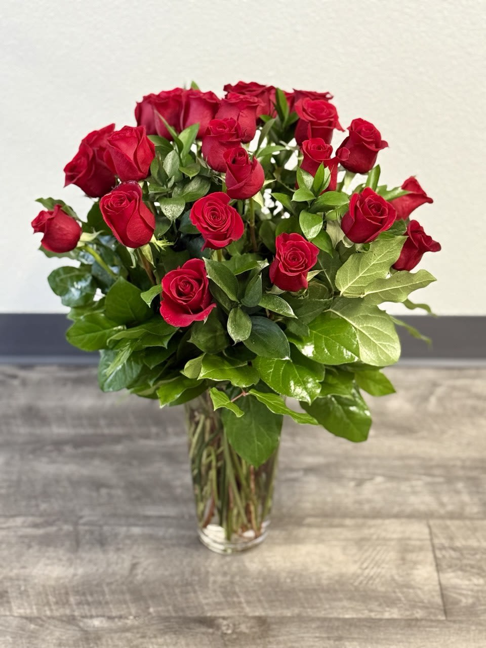 Bouquet of red roses in a clear glass vase