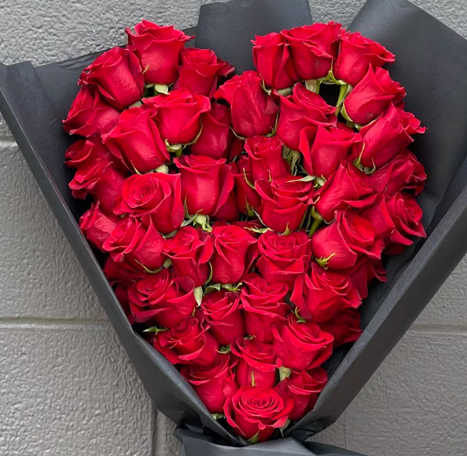 Laid Bouquet - Rose Heart  - This gorgeous bouquet will be wrapped with paper and ribbon. Heart shaped laid bunch of roses to present to the one you love