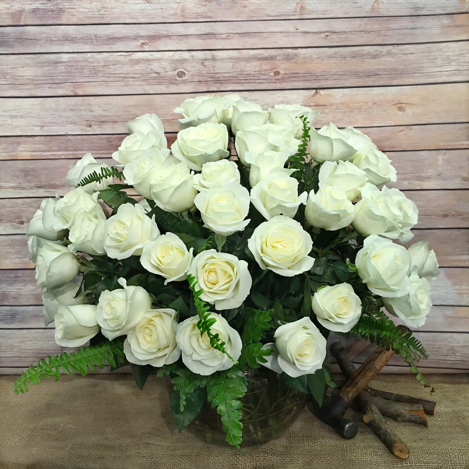Bouquet of white roses in a glass vase