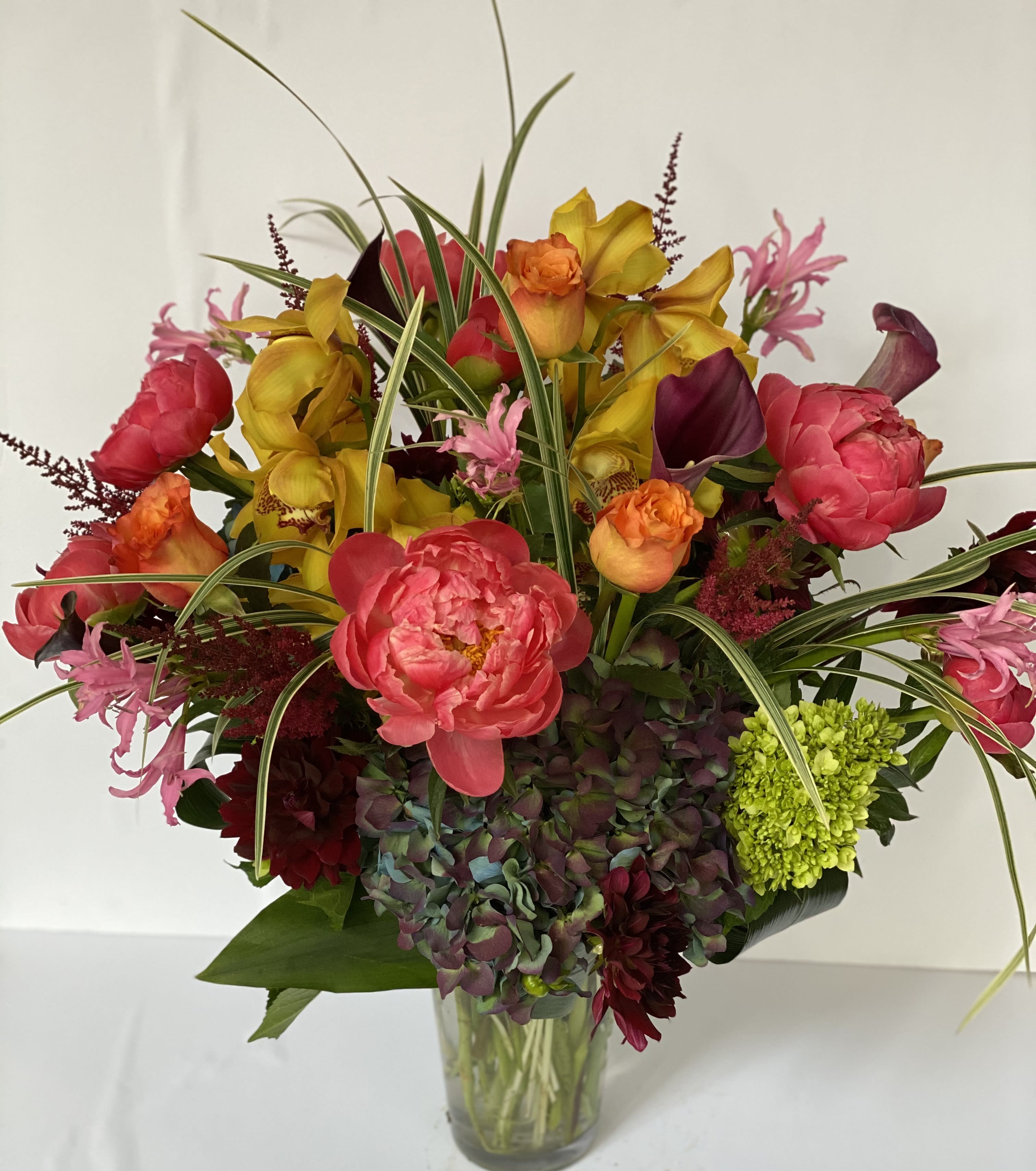 Colorful mixed bouquet in a clear glass vase