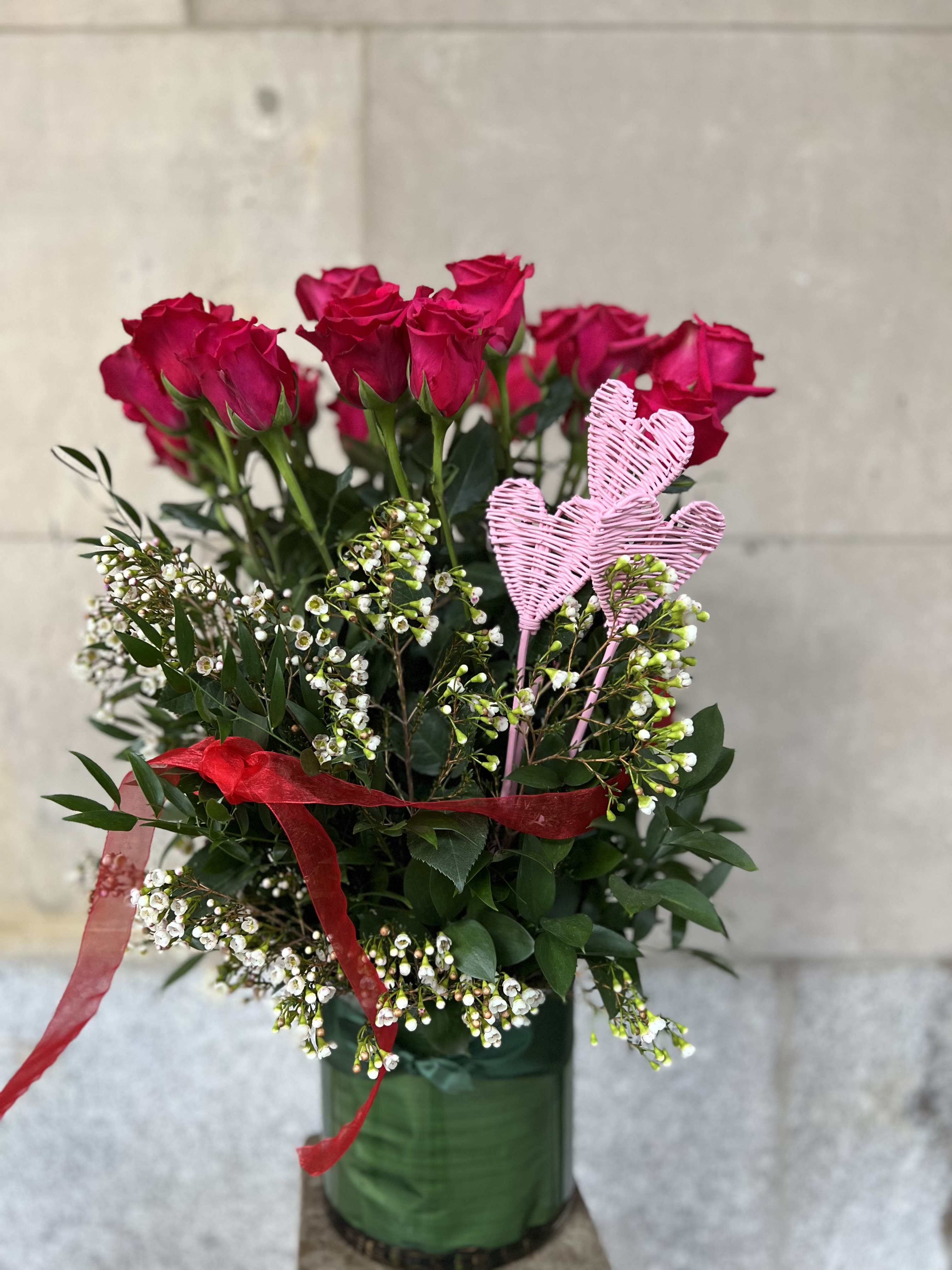 SWEETHEART 2 (HOT PINK COLOR)  - We are pleased to highlight our exquisite collection of long-stemmed roses, expertly arranged by Flowers by Philip. These classic arrangements, accented with seasonal foliage, are available in three stunning options:  * **Standard Version:** Dozen long-stemmed roses  * **Deluxe Version:** Dozen and a half long-stemmed roses  * **Premium Version:** Two dozen long-stemmed roses   For a truly unforgettable gift, choose the timeless elegance of long-stemmed roses by Flowers by Philip.